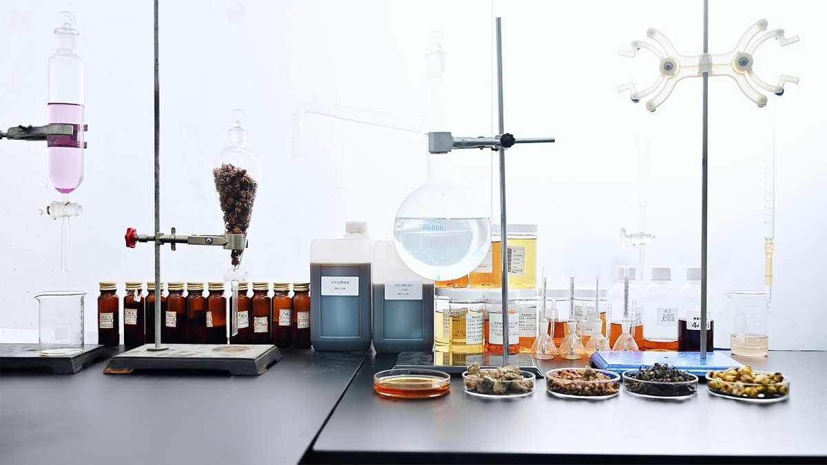 Laboratory workspace showcasing premium skincare raw materials and testing equipment