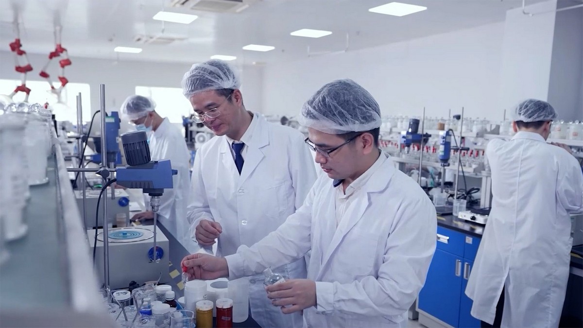 Senior PhDs and researchers conducting skincare experiments in the DEVA laboratory